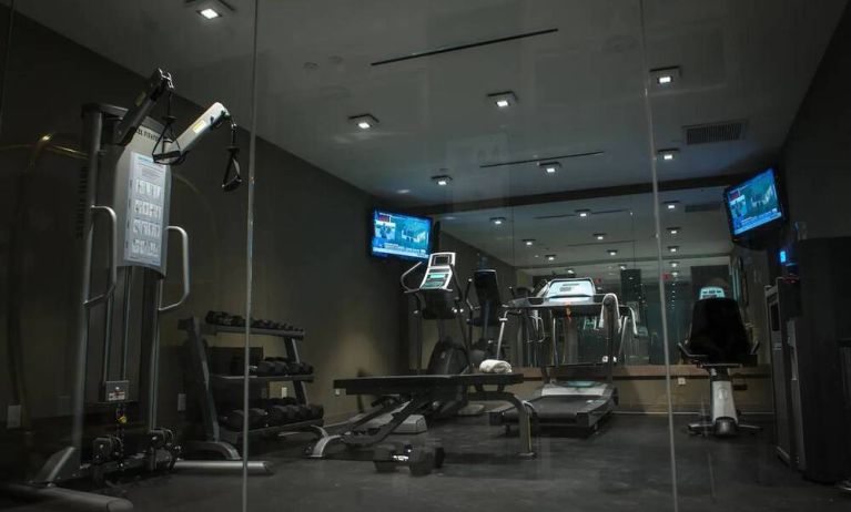 The hotel’s exercise room, with stacked weights and assorted fitness machines.