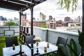 Outdoor terrace with table and chairs for relaxing/socializing.