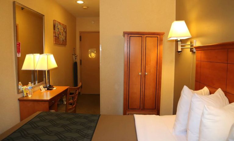 Guest room at the Econo Lodge Times Square, with large bed, desk for working, and wardrobe.