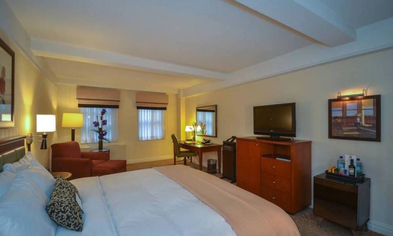 Double bedroom in the San Carlos Hotel, with desk for working, plus window, chair, and television.