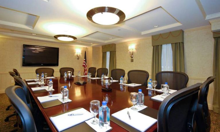 A meeting room in the San Carlos Hotel, with long table and space for a dozen attendees.