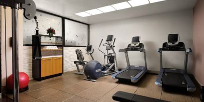 The hotel’s fitness center, equipped with a range of exercise machines.