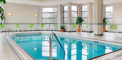 The hotel’s swimming pool is indoors and has plenty of chairs by the side.