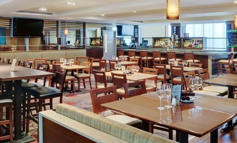 The hotel’s on-site restaurant has a bar and mix of ordinary and tall stool seating.