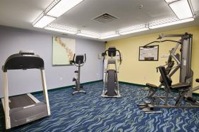 The hotel fitness center is equipped with a variety of exercise machines.