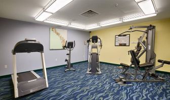 The hotel fitness center is equipped with a variety of exercise machines.