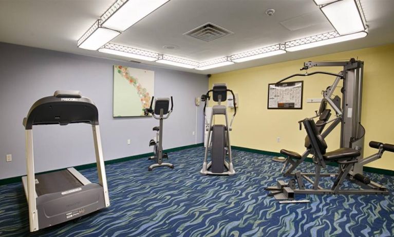 The hotel fitness center is equipped with a variety of exercise machines.