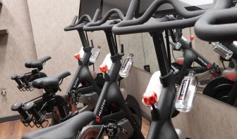 The hotel fitness center, equipped with Peloton exercise bikes.