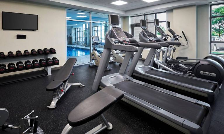 The Holiday Inn & Suites Oakville At Bronte fitness center is equipped with weights, benches, and numerous exercise machines.