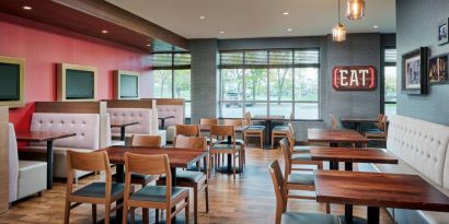 Burger Theory Restaurant and Bar is the on-site dining venue, with tables for four or two diners.