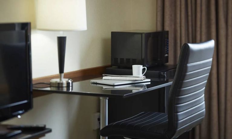 Workspace desk and chair in one of Comfort Inn Moncton Magnetic Hill’s guest rooms.