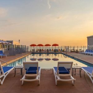 Stunning outdoor pool at sunset at Sea Crest Beach Hotel.