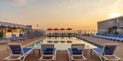 Stunning outdoor pool at sunset at Sea Crest Beach Hotel.