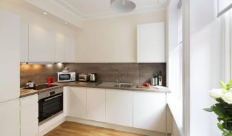 The Hammersmith One’s kitchen, including kettle, oven, microwave, and toaster.