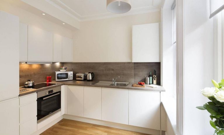 The Hammersmith One’s kitchen, including kettle, oven, microwave, and toaster.