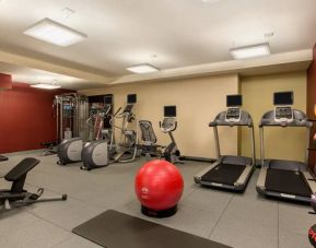 The hotel fitness center where guests can use exercise machines, balls, and weights.