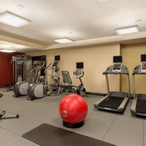 The hotel fitness center where guests can use exercise machines, balls, and weights.