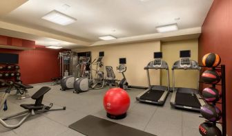 The hotel fitness center where guests can use exercise machines, balls, and weights.