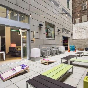 The hotel’s patio area, with plentiful seating and tall stools/tables.