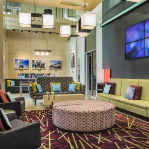 The hotel’s lounge, with comfortable chairs and sofas, and many cushions.