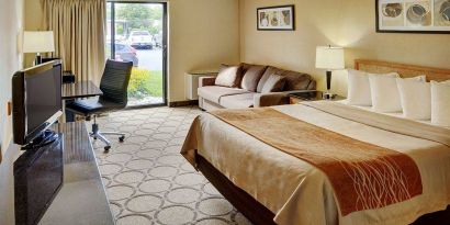 Double bed guest room in the Comfort Inn Fredericton, with large window and TV.