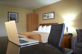 An in-room workspace desk and chair at Comfort Inn Fredericton.