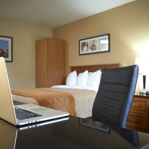 An in-room workspace desk and chair at Comfort Inn Fredericton.