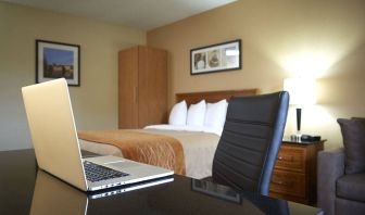 An in-room workspace desk and chair at Comfort Inn Fredericton.