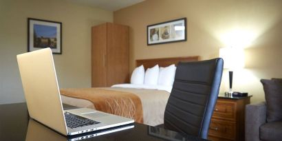 An in-room workspace desk and chair at Comfort Inn Fredericton.