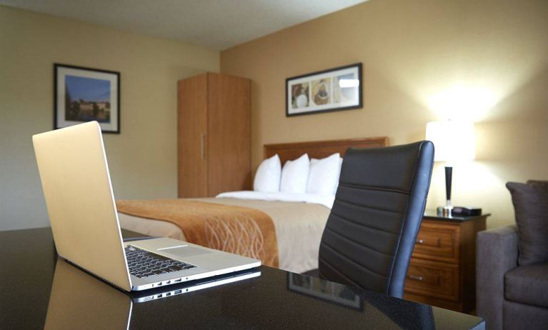 An in-room workspace desk and chair at Comfort Inn Fredericton.