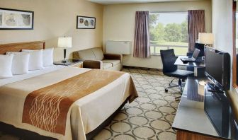 Comfort Inn Fredericton guest room featuring double bed and a workspace desk and chair.