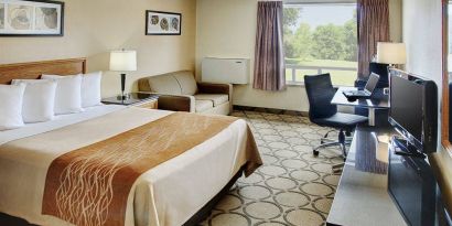 Comfort Inn Fredericton guest room featuring double bed and a workspace desk and chair.