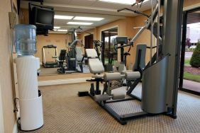 Comfort Inn Fredericton’s fitness center has multiple exercise machines and an overhead TV.