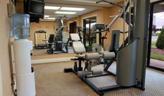 Comfort Inn Fredericton’s fitness center has multiple exercise machines and an overhead TV.