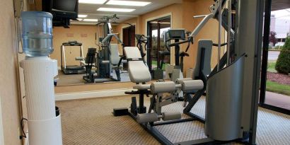 Comfort Inn Fredericton’s fitness center has multiple exercise machines and an overhead TV.