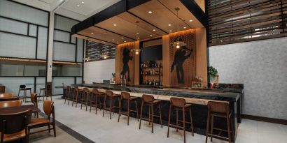 The hotel bar has traditional tall bar stools and a wide range of beverages.