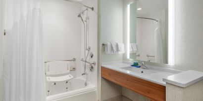 Private guest bathroom with shower at Holiday Inn Express & Suites Ontario.