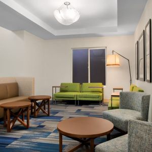 Comfortable lobby and coworking space at Holiday Inn Express & Suites Ontario.