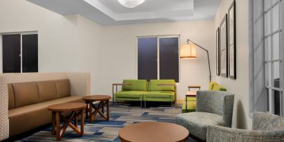 Comfortable lobby and coworking space at Holiday Inn Express & Suites Ontario.