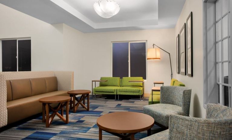 Comfortable lobby and coworking space at Holiday Inn Express & Suites Ontario.