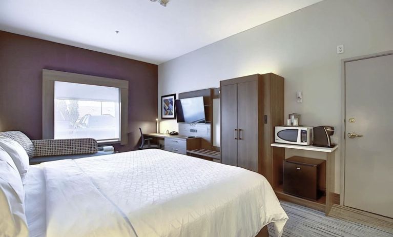 Spacious delux king room with TV and work desk at Holiday Inn Express & Suites Airport-Calgary.