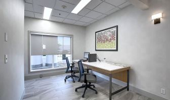 Dedicated business center with PC, internet, printer, and work space at Holiday Inn Express & Suites Airport-Calgary.