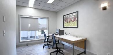 Dedicated business center with PC, internet, printer, and work space at Holiday Inn Express & Suites Airport-Calgary.