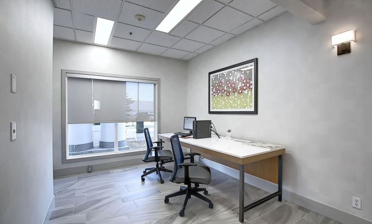 Dedicated business center with PC, internet, printer, and work space at Holiday Inn Express & Suites Airport-Calgary.