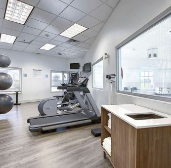 Well equipped fitness center at Holiday Inn Express & Suites Airport-Calgary.