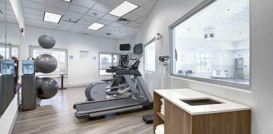 Well equipped fitness center at Holiday Inn Express & Suites Airport-Calgary.