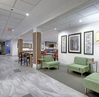 Comfortable lobby and coworking space at Holiday Inn Express & Suites Airport-Calgary.