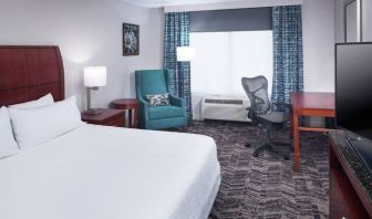 Spacious king suite with TV and business desk at Hilton Garden Inn Dallas/Allen.