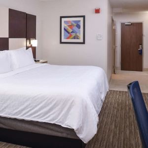 Delux king bed with TV and business desk at Holiday Inn Express Towson Baltimore N.