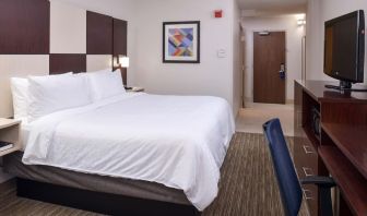 Delux king bed with TV and business desk at Holiday Inn Express Towson Baltimore N.